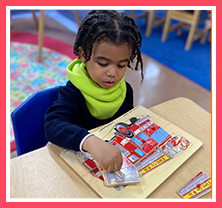 boy with fire truck puzzle