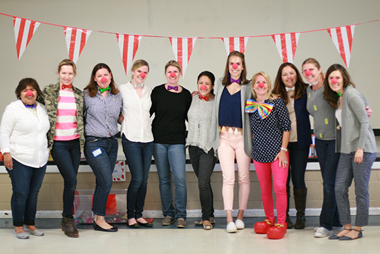 Smiling women with clown noses