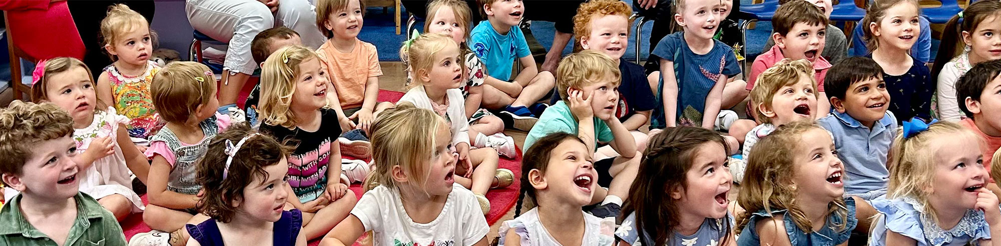 Spring Valley students laughing and watching an educational presentation together