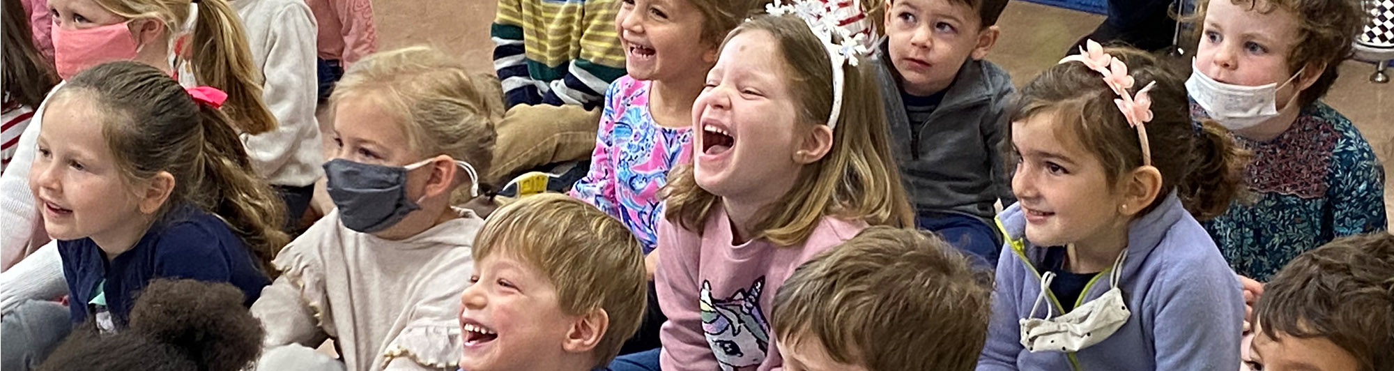 Spring Valley students laughing and watching an educational presentation together